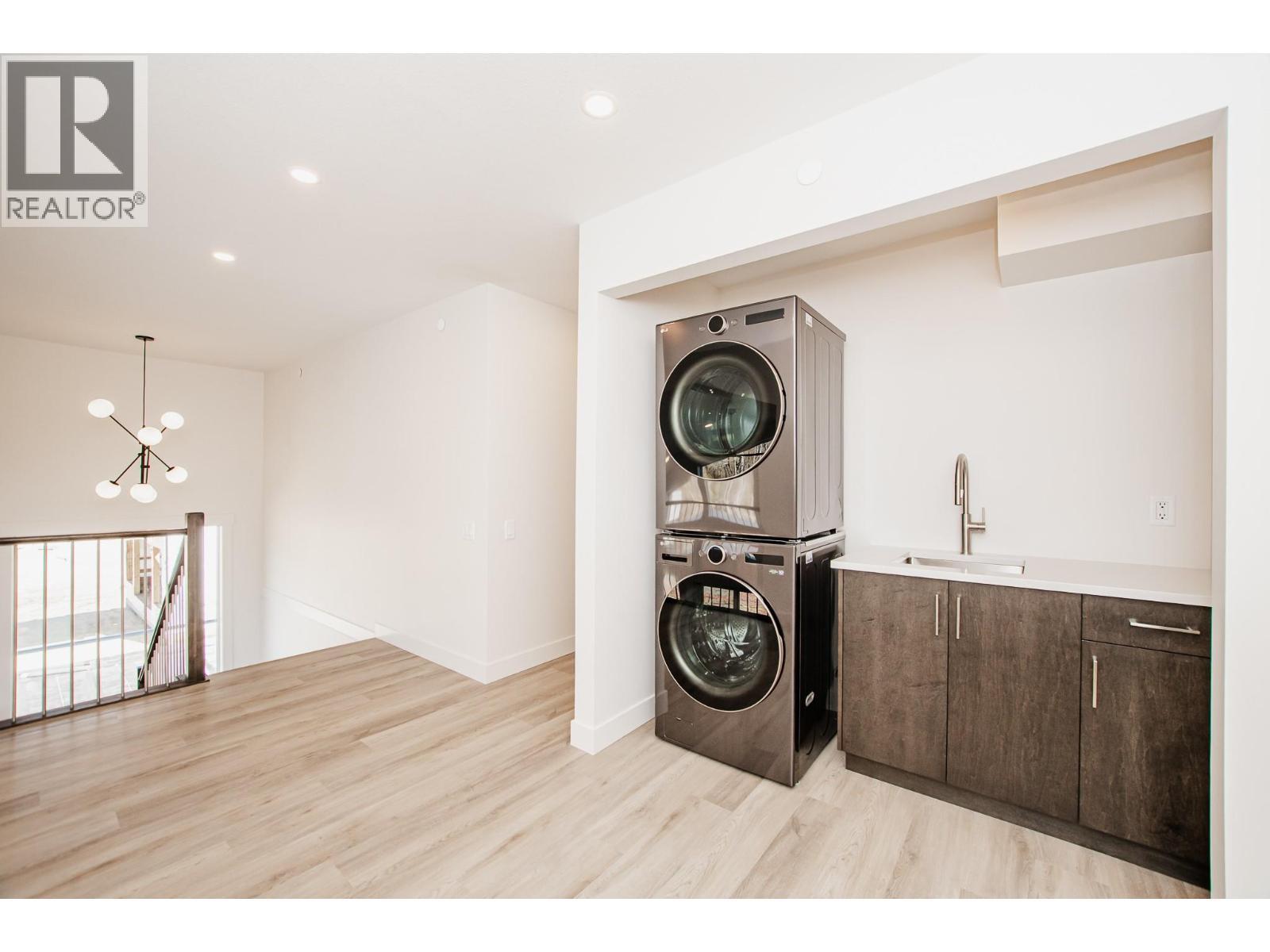 8200 97A Highway Unit# 8, Mara, BC - Indoor Photo Showing Laundry Room
