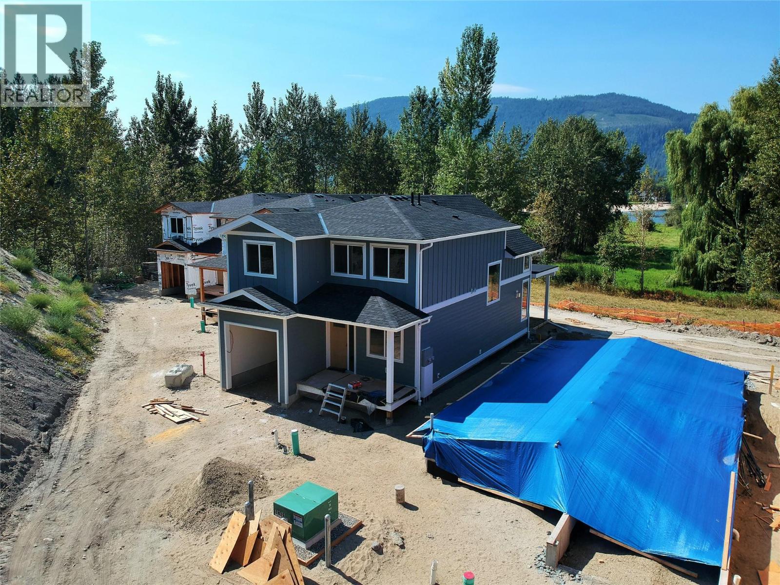 Photo for likeness reference (Unit 3) - 8200 97A Highway Unit# 8, Mara, BC - Outdoor With In Ground Pool With Deck Patio Veranda