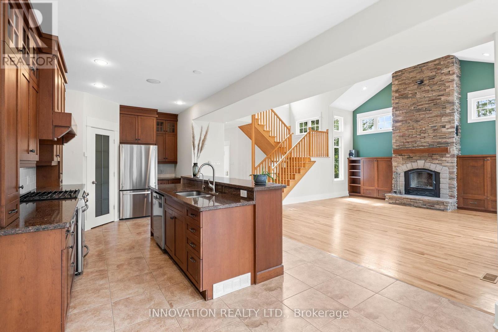 199 Blackberry Way, Ottawa, ON - Indoor Photo Showing Kitchen With Fireplace With Stainless Steel Kitchen With Double Sink