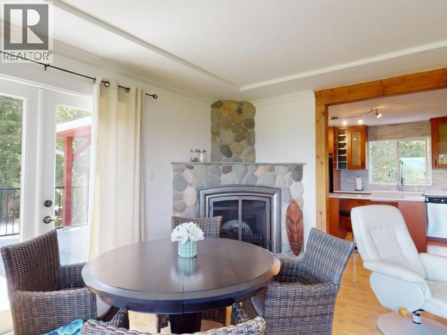 2389 Wall Street, Texada Island, BC - Indoor Photo Showing Other Room With Fireplace