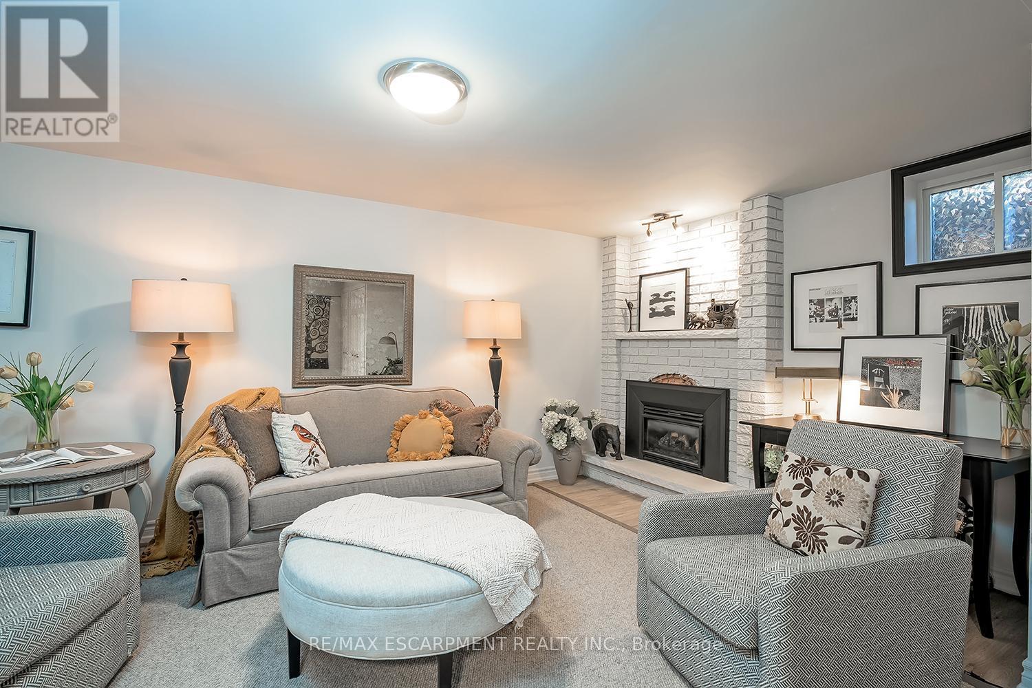 5 - 1580 Kerns Road, Burlington, ON - Indoor Photo Showing Living Room With Fireplace
