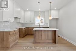 designer kitchen with upgraded quartz countertops -