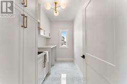 main floor laundry with quartz counters -