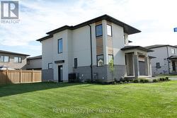 spacious side yard with entrance to lower level -