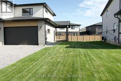 covered porch with spacious sideyard -