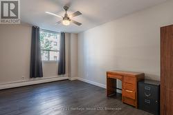 Bedroom w/Laminate Floor and Ceiling Fan -