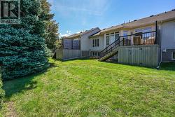 back deck and yard w/mature trees -