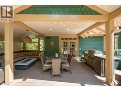 Enjoy the covered and screened porch with BBQ kitchen -