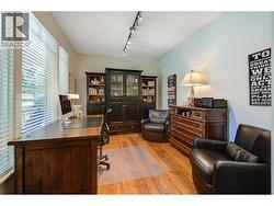 Den located off entrance -