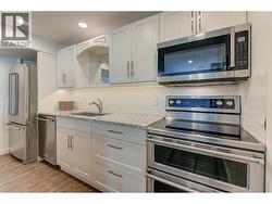 Quartz island kitchen with double oven -