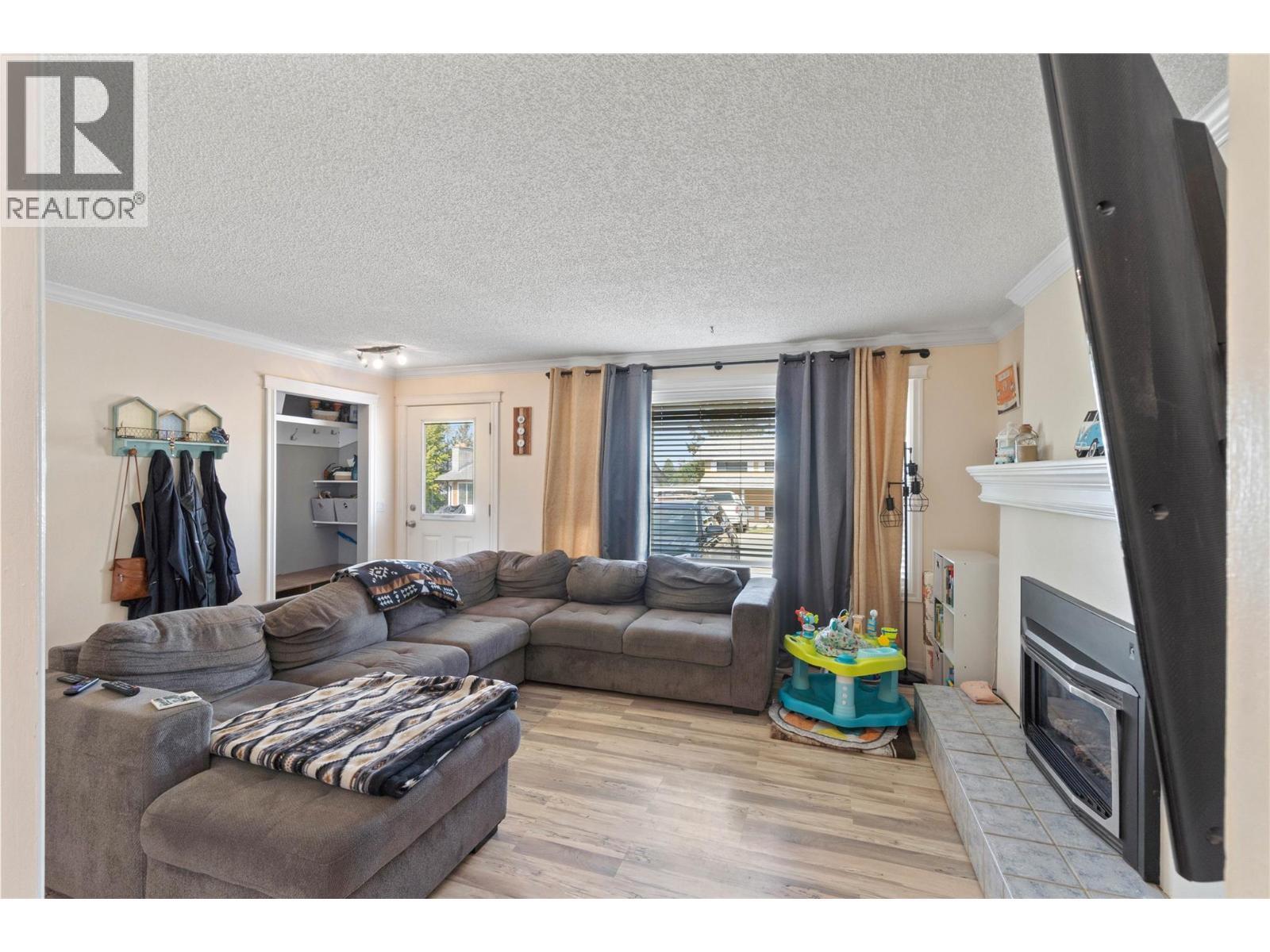 254 Alder Drive, Logan Lake, BC - Indoor Photo Showing Living Room With Fireplace