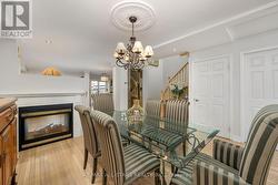 Dining Room With Cozy 2-Sided Gas Fireplace -