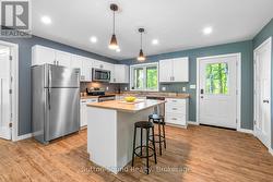 Open kitchen with island and island -