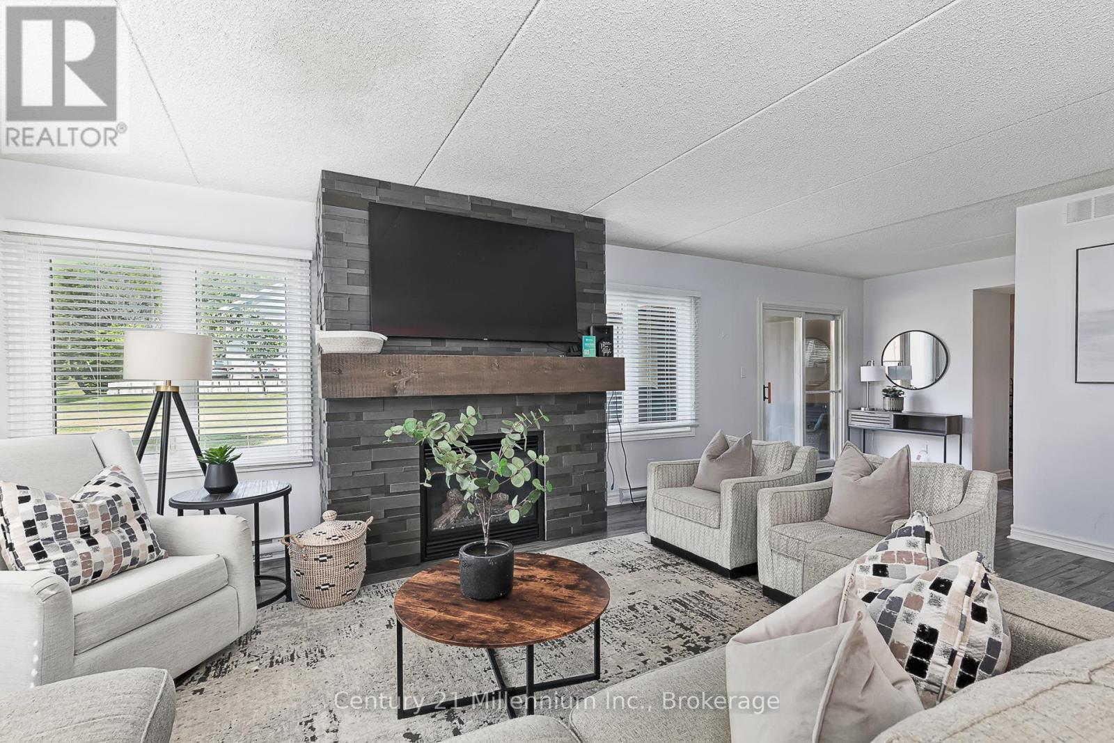 118 - 169 Jozo Weider Boulevard, Blue Mountains, ON - Indoor Photo Showing Living Room With Fireplace