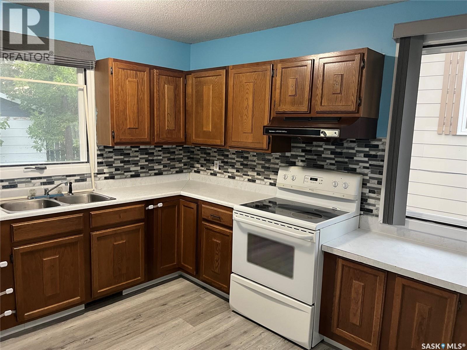 220 Knobel Street, Foam Lake, SK - Indoor Photo Showing Kitchen With Double Sink