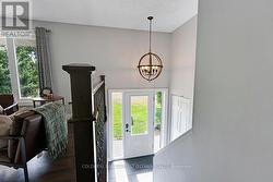 White and bright foyer has ceramic floor -