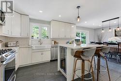 Kitchen island-breakfast bar with bar fridge -