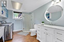 Lower level 3-pc bathroom has marble vanity -