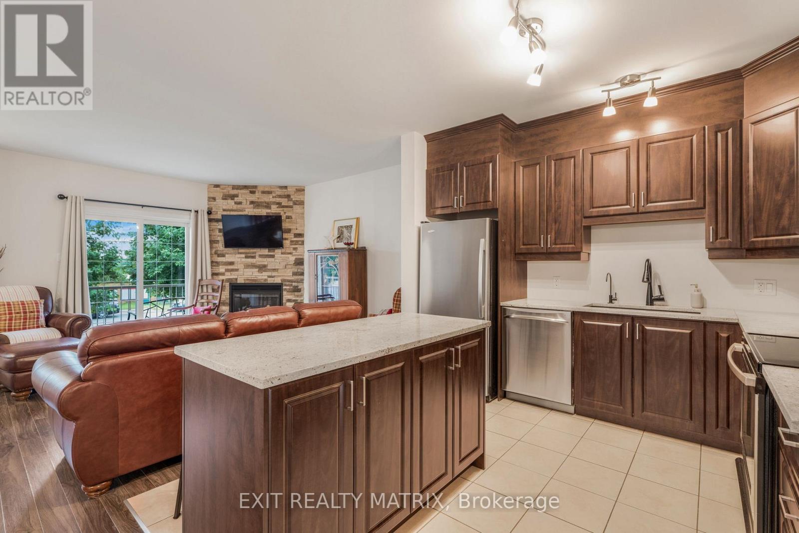 2 - 193 Bourdeau Boulevard, The Nation, ON - Indoor Photo Showing Kitchen With Fireplace
