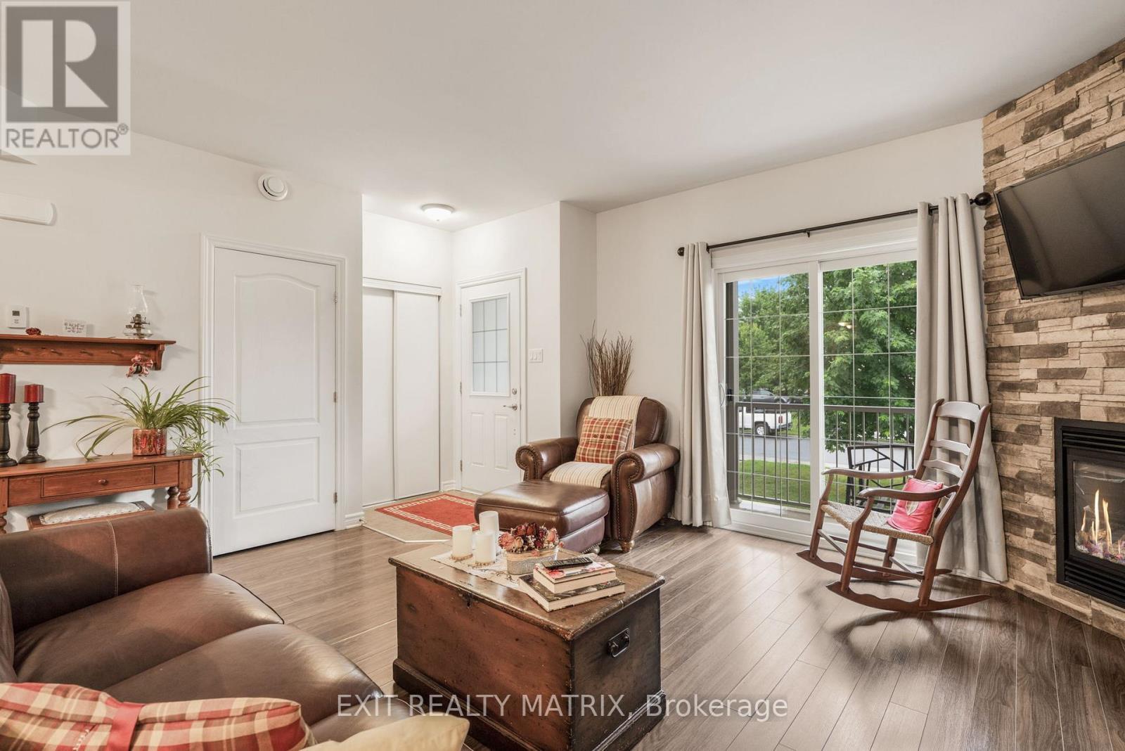 2 - 193 Bourdeau Boulevard, The Nation, ON - Indoor Photo Showing Living Room With Fireplace