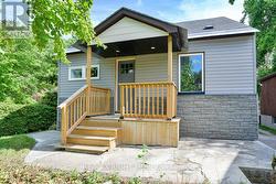 Front porch with concrete pad out front. -