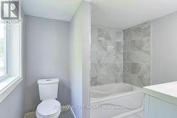 Main 4pc. bathroom; dual flush toilet. -