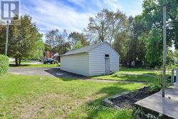 Wood-sided storage building 17' x 25'. -