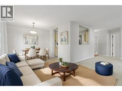 Living/dining room virtually staged. -