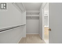 Primary bedroom walk-in closet -