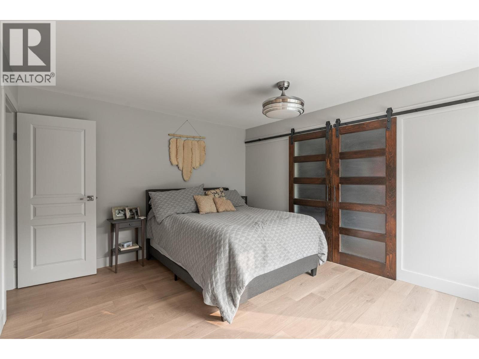 Primary bedroom - 8990 College Drive, Coldstream, BC - Indoor Photo Showing Bedroom