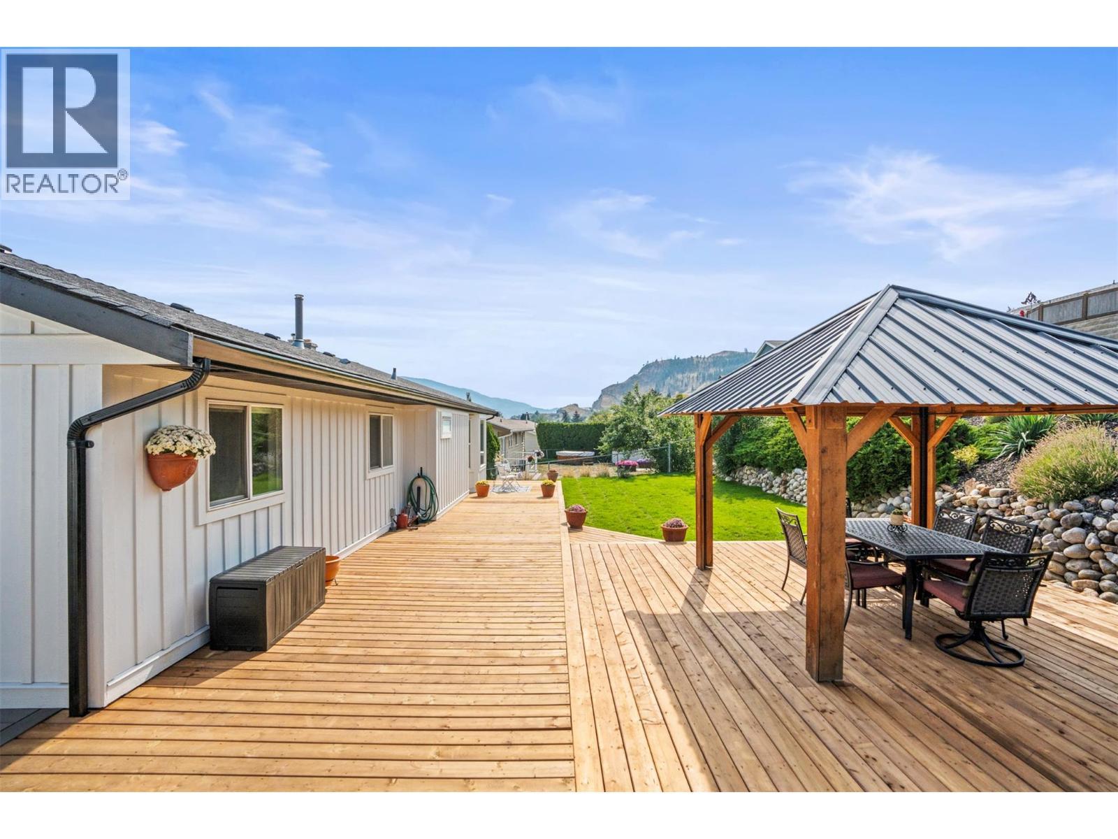 Backyard-new deck - 8990 College Drive, Coldstream, BC - Outdoor With Deck Patio Veranda With Exterior