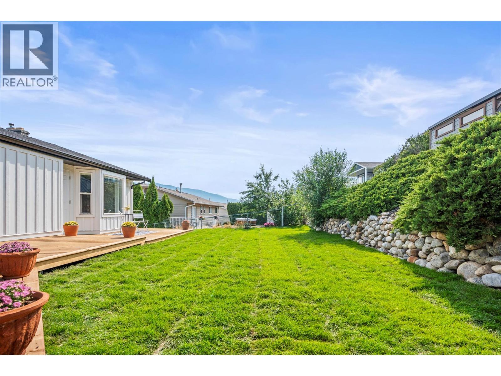 Backyard space - 8990 College Drive, Coldstream, BC - Outdoor With Deck Patio Veranda