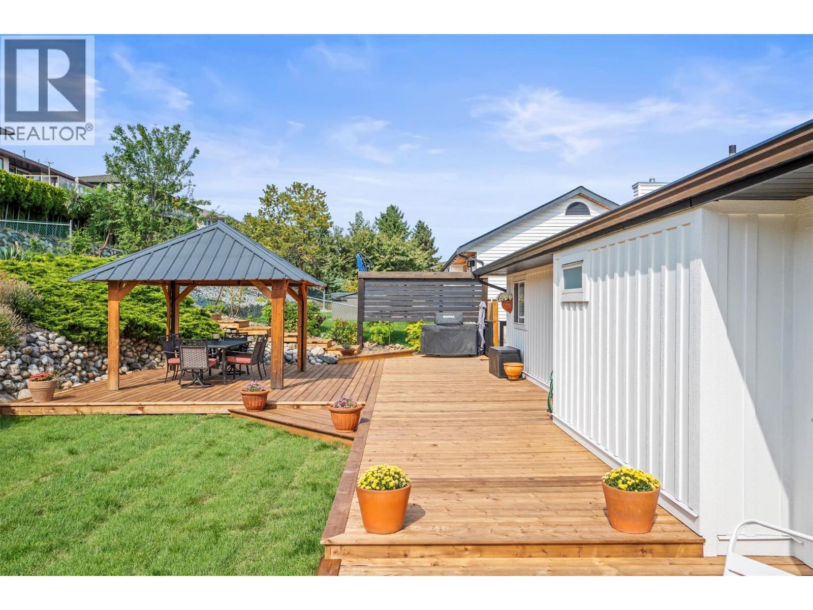 Backyard space - 8990 College Drive, Coldstream, BC - Outdoor With Deck Patio Veranda