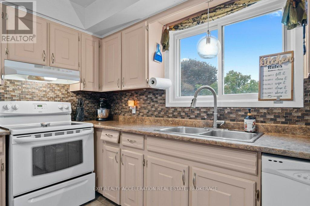 19 Mortensen Drive, Loyalist (Amherstview), ON - Indoor Photo Showing Kitchen With Double Sink