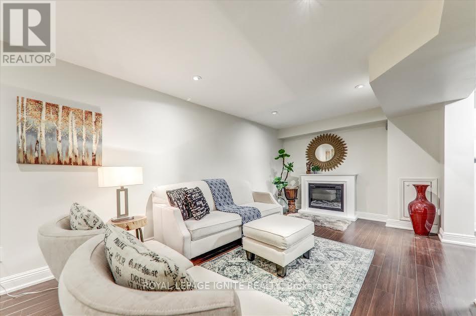 26 Halfmoon Square, Toronto, ON - Indoor Photo Showing Living Room With Fireplace