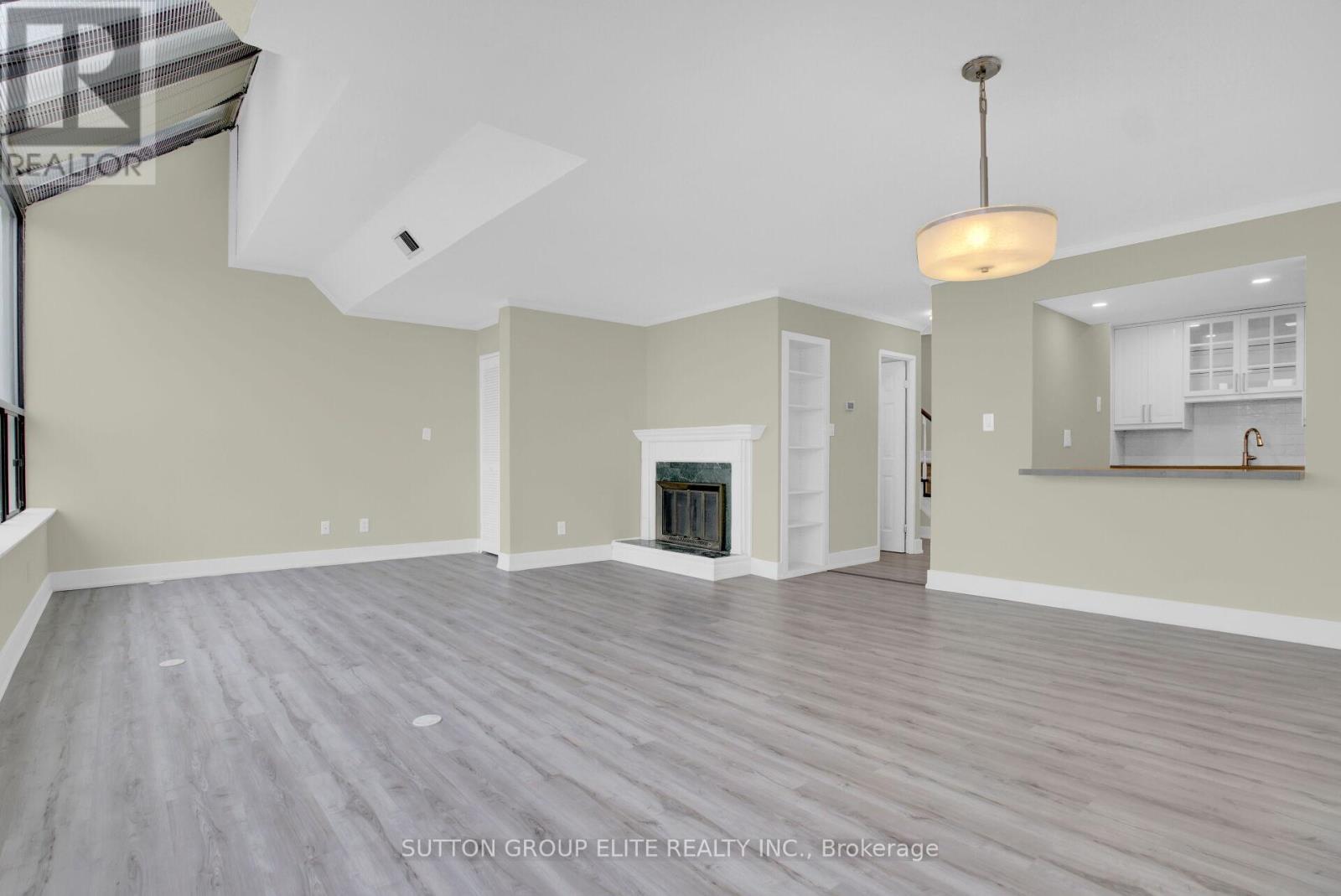 5 - 200 Robert Speck Parkway, Mississauga, ON - Indoor With Fireplace