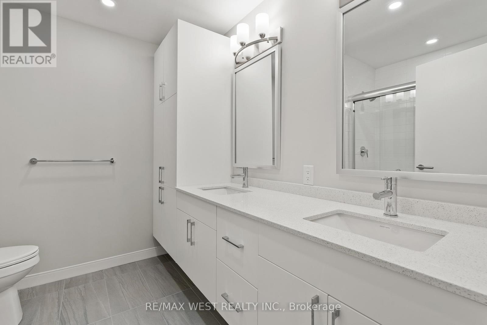 His & Her Sinks, and lots of added on Cabinetry - 502 - 118 West Street, Port Colborne, ON - Indoor Photo Showing Bathroom