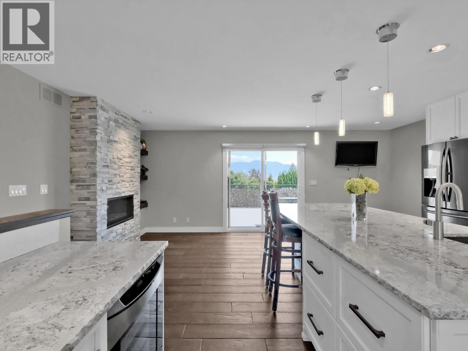 2284 Westville Place, West Kelowna, BC - Indoor Photo Showing Kitchen With Fireplace With Upgraded Kitchen
