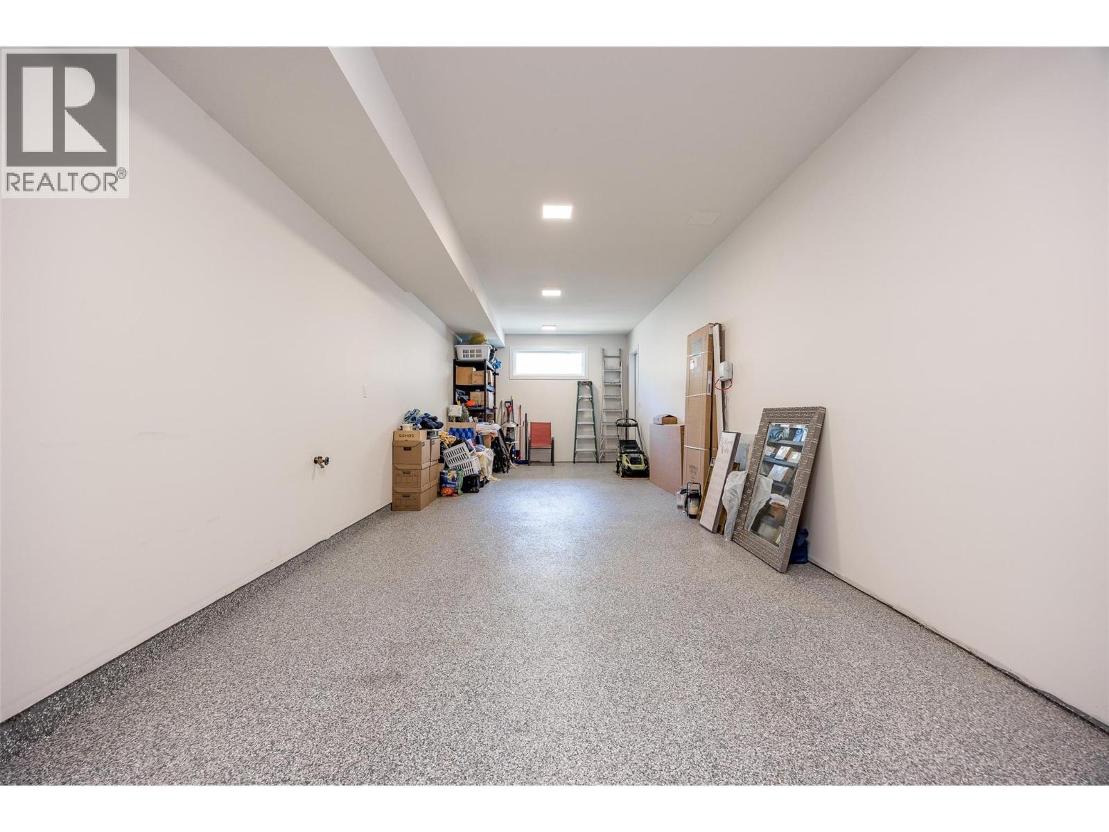 Forty two foot double bay on one side of garage. - 162 Echo Ridge Drive, Kelowna, BC - Indoor Photo Showing Other Room