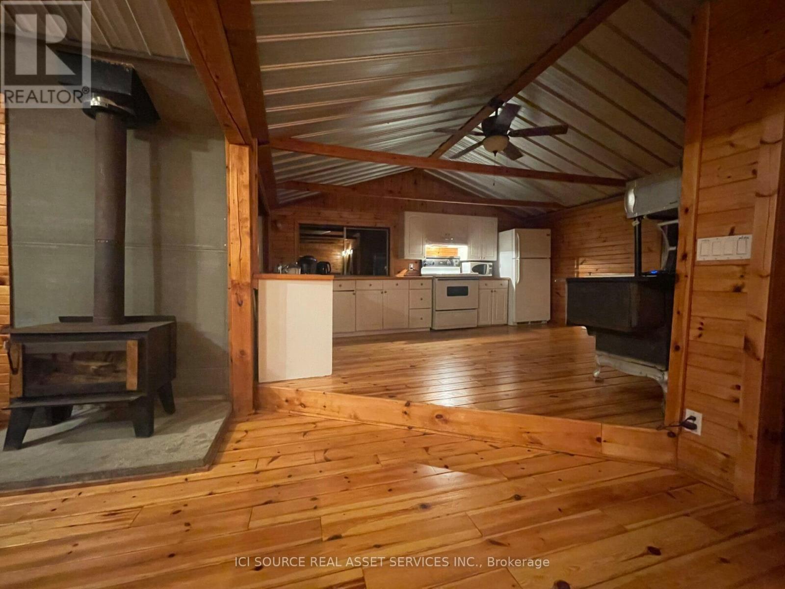 596C Ham Lake Road E, Killarney, ON - Indoor With Fireplace