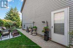 Side of yard with entrance to garage -