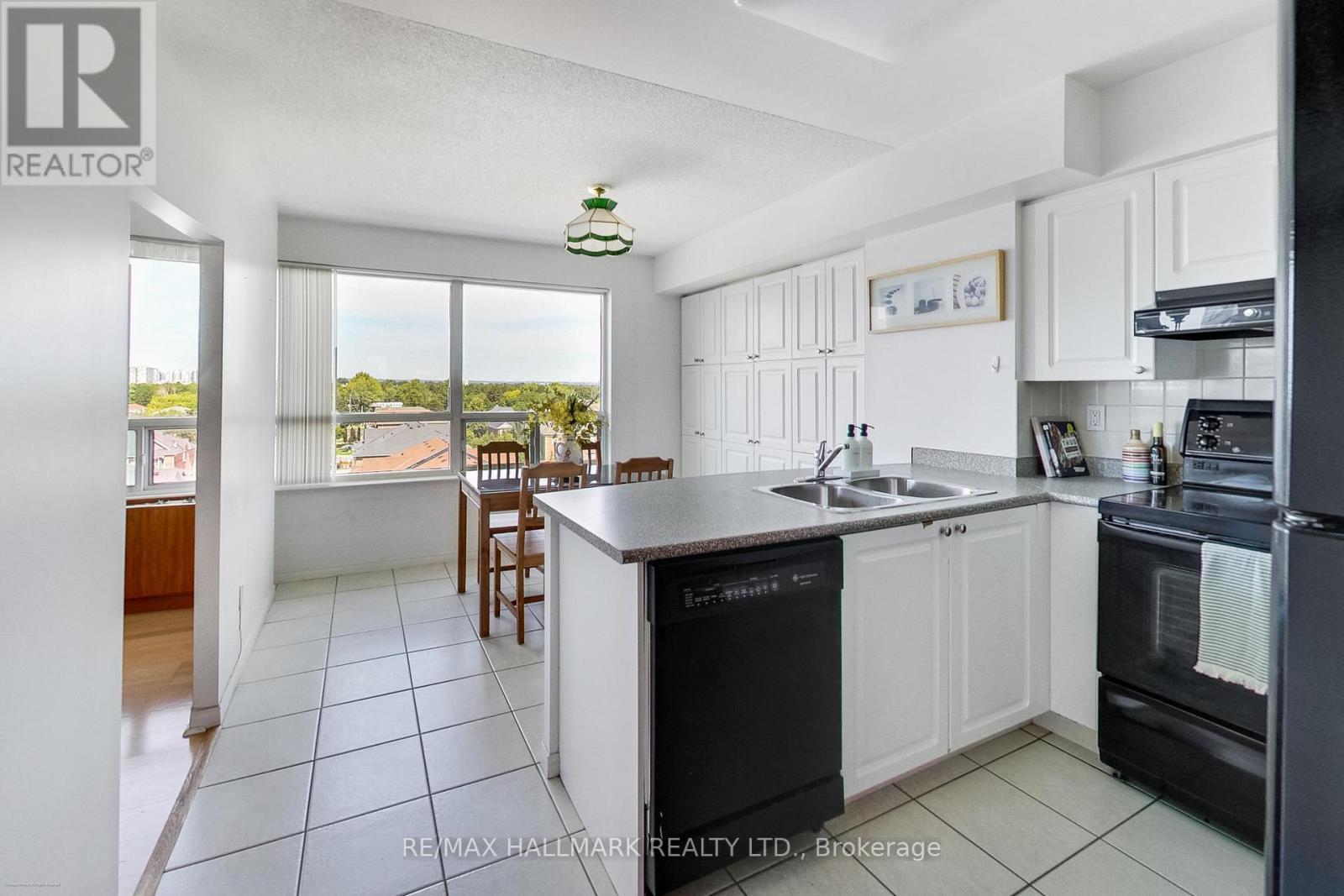 Walk-Out To Terrace - 702 - 5 Emerald Lane, Vaughan, ON - Indoor Photo Showing Kitchen With Double Sink