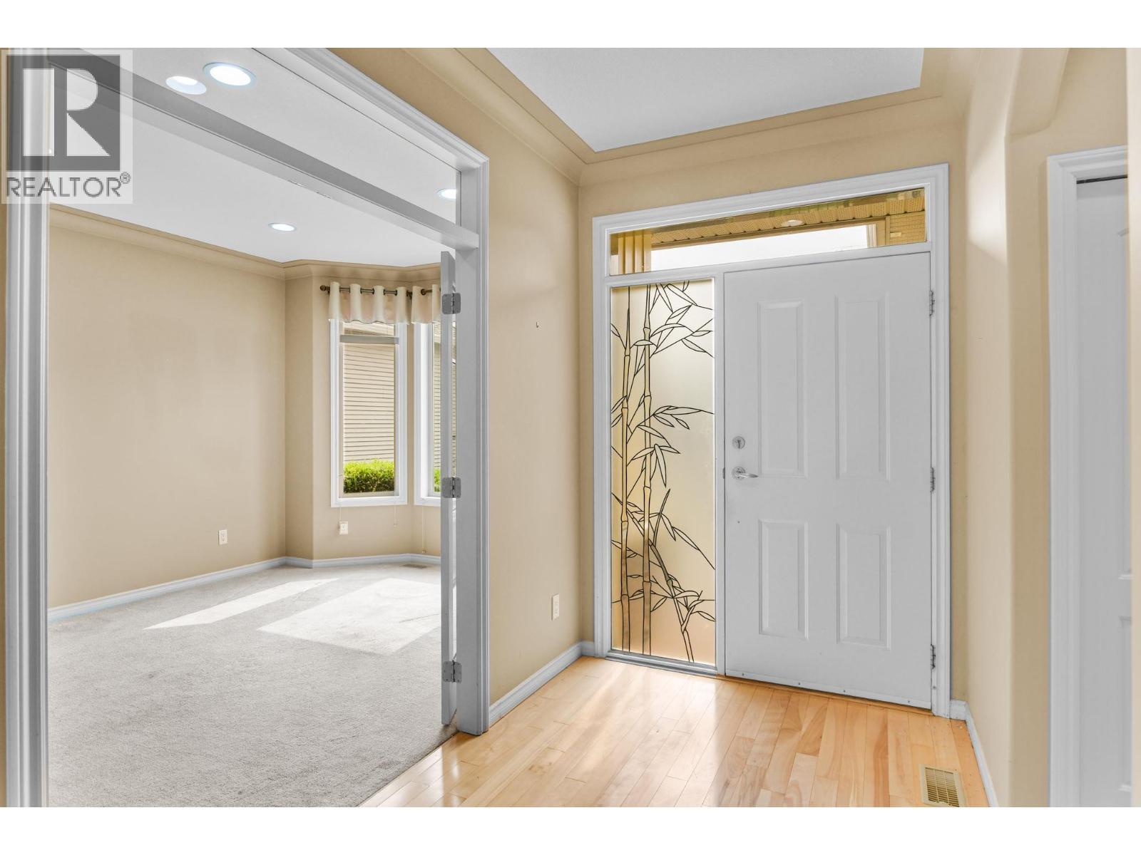french door entrance to den / bedroom / tv room - 2365 Stillingfleet Road Unit# 39, Kelowna, BC - Indoor Photo Showing Other Room