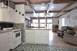 Wood Beam Ceilings looks through to Lake -