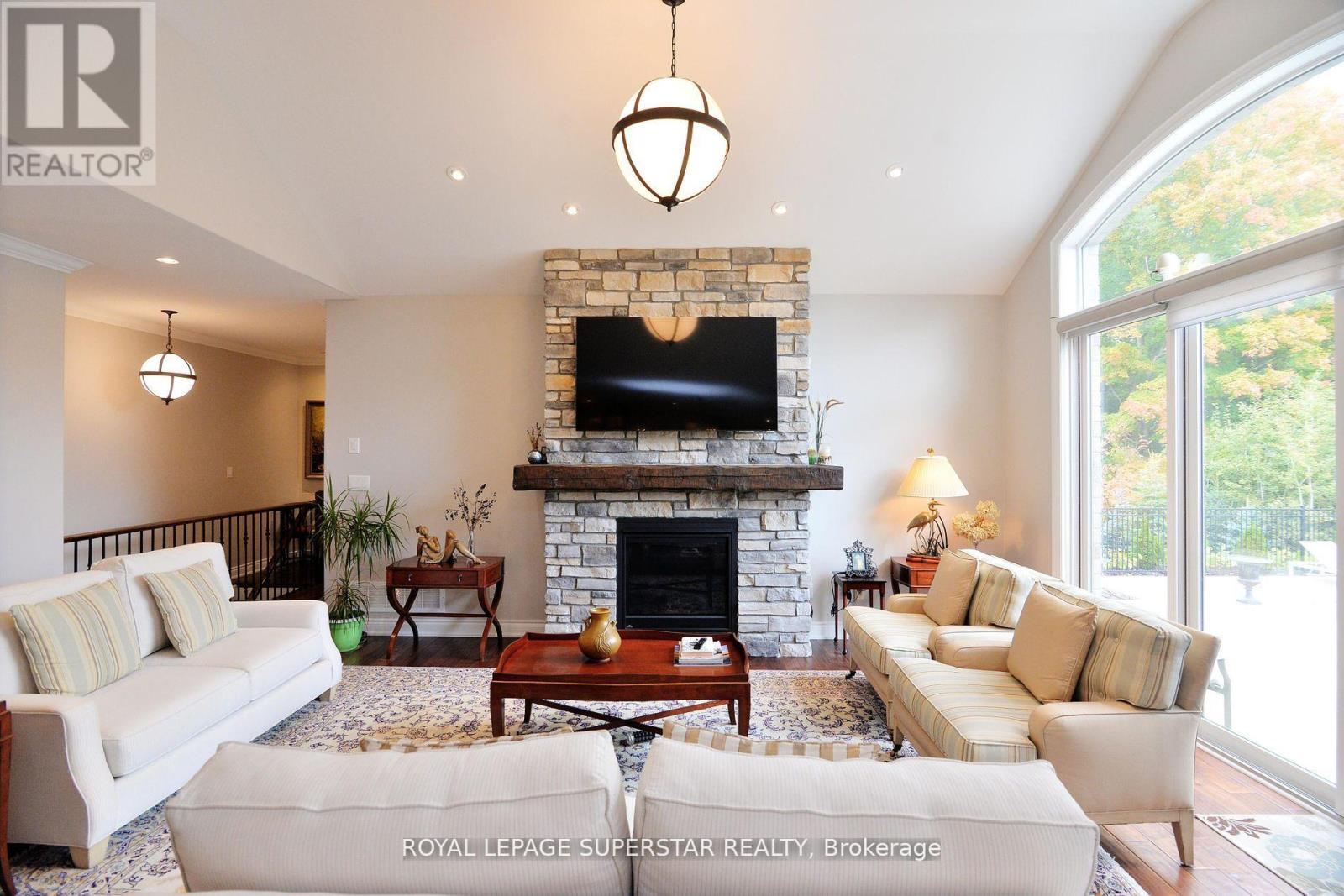 9 Black Creek Trail, Springwater, ON - Indoor Photo Showing Living Room With Fireplace
