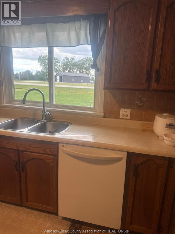 830 Talbot Road, Wheatley, ON - Indoor Photo Showing Kitchen With Double Sink