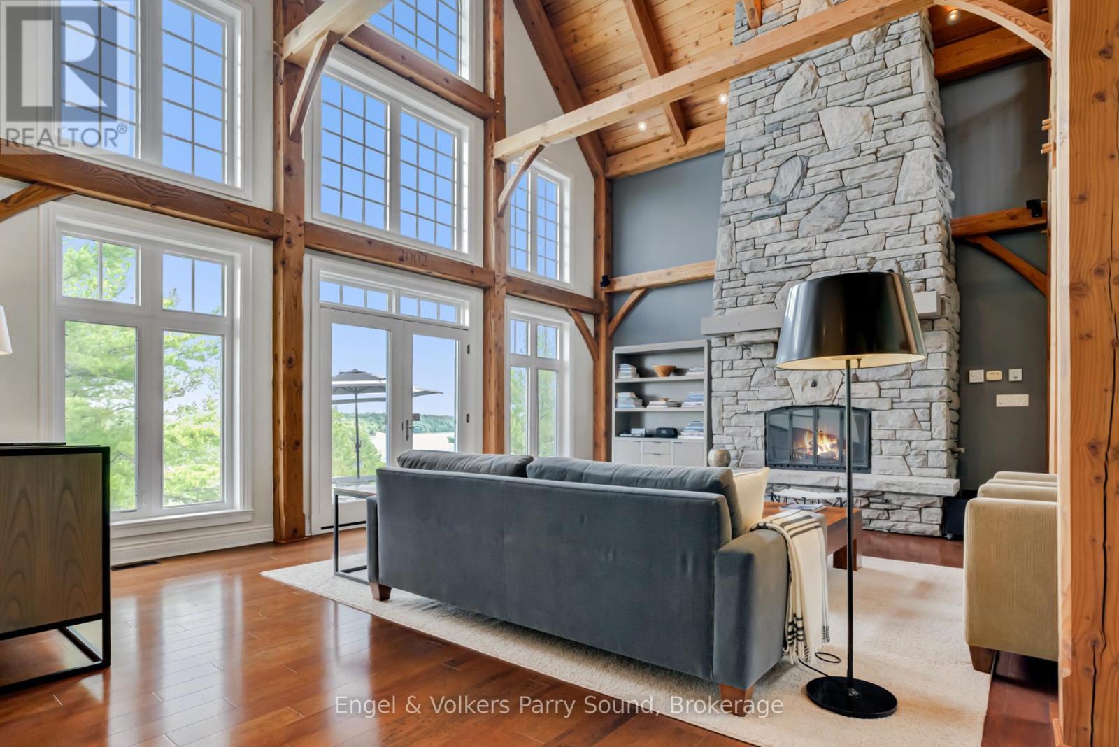 22 Beacon Point Drive, Carling, ON - Indoor Photo Showing Living Room With Fireplace