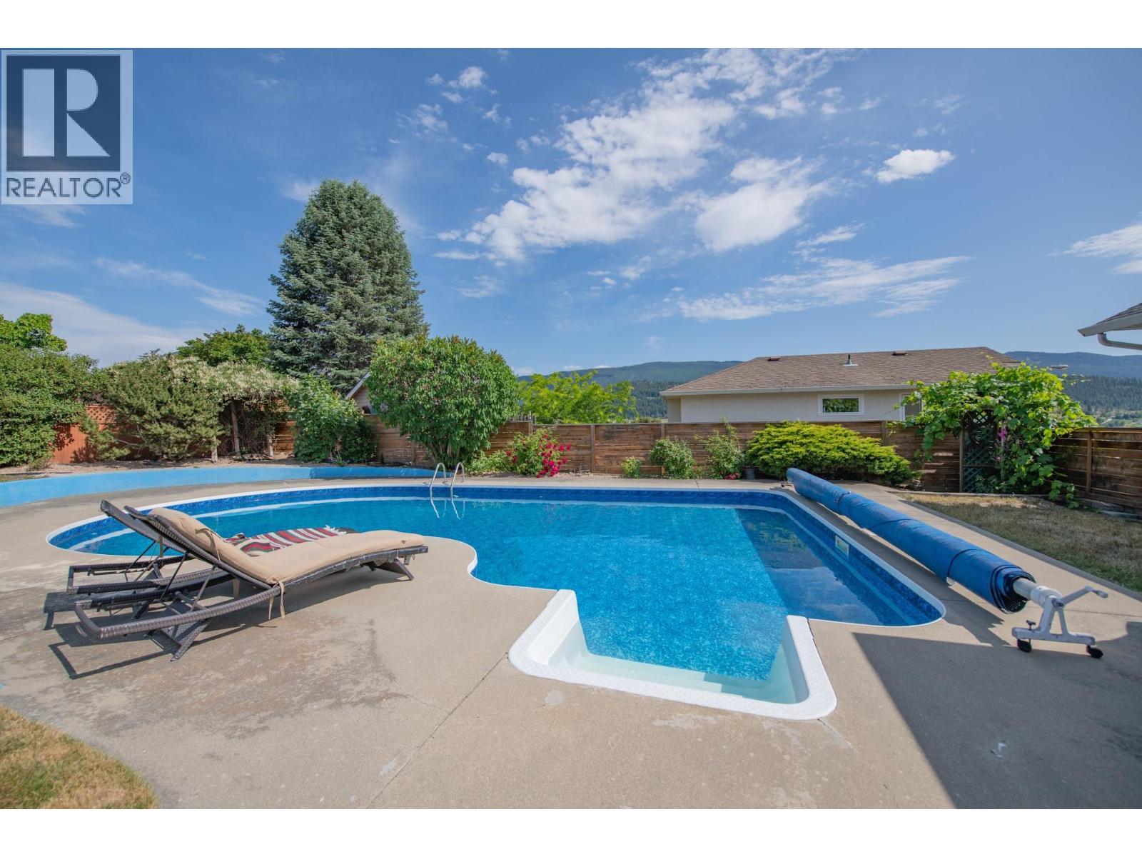 8841 Michael Drive, Coldstream, BC - Outdoor With In Ground Pool With Backyard