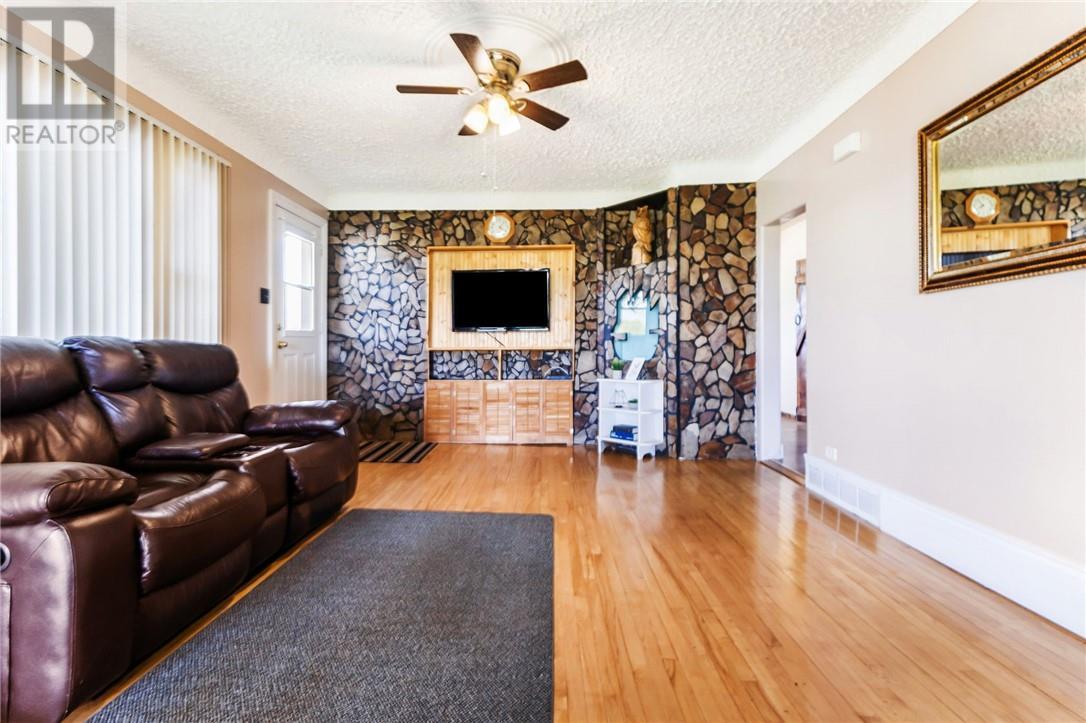 3201 Main Street, Blezard Valley, ON - Indoor Photo Showing Living Room With Fireplace