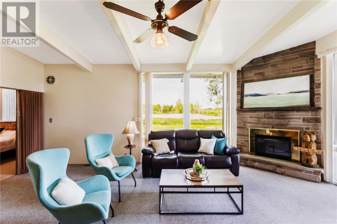 3201 Main Street, Blezard Valley, ON - Indoor Photo Showing Living Room With Fireplace